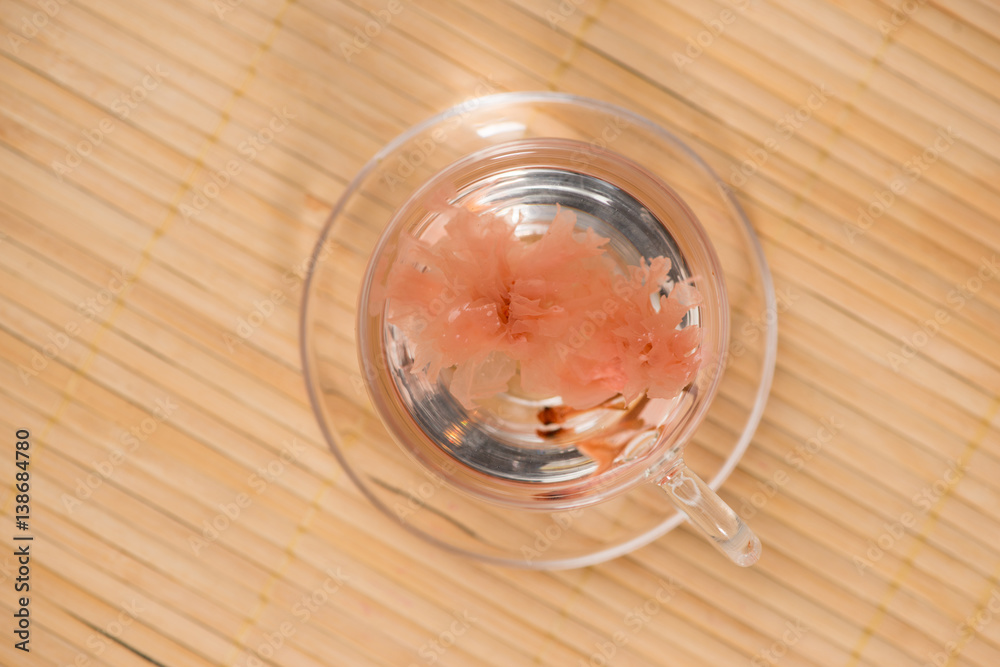 Cherry blossom (sakura) Japanese Herb tea on table.