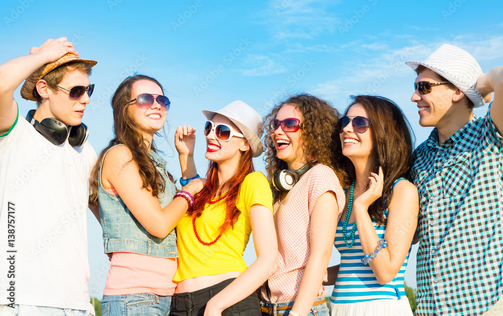 group of young people wearing sunglasses and hat