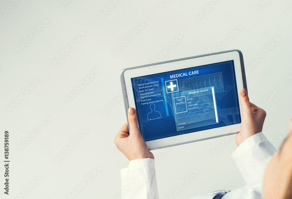 Close of female doctor hands working with tablet pc computer