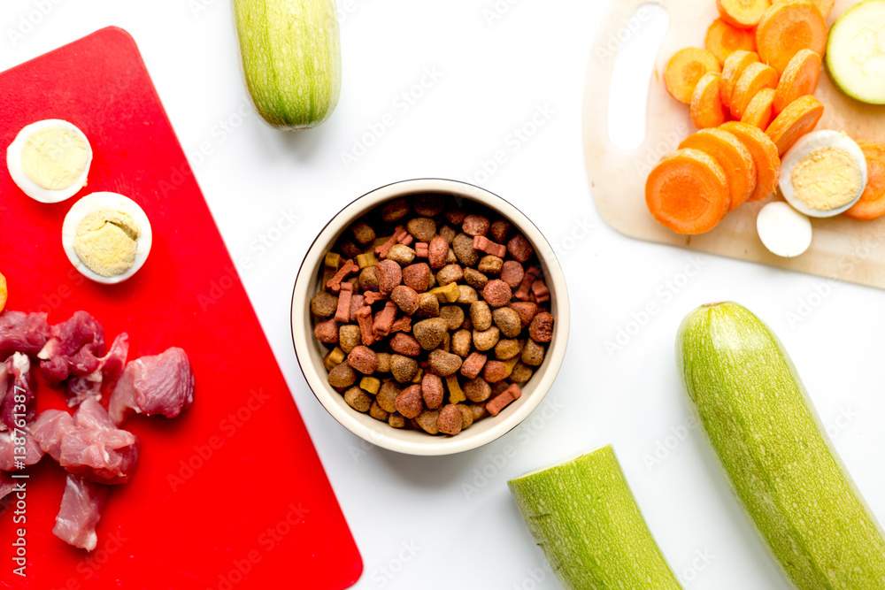 Set of animal food, meat,vegetables and eggs on kitchen top view