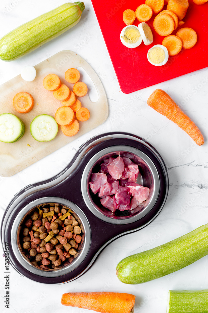 organic pets food with zucchini and carrot on table background top view