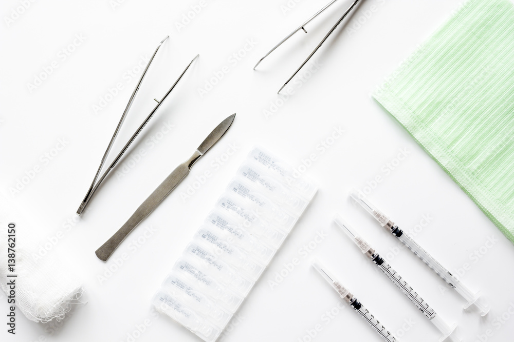 instruments of gynecologist on white background top view mock up