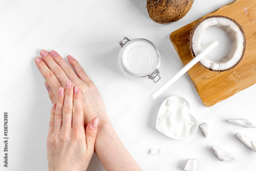 organic cosmetics with coconut on white background top view