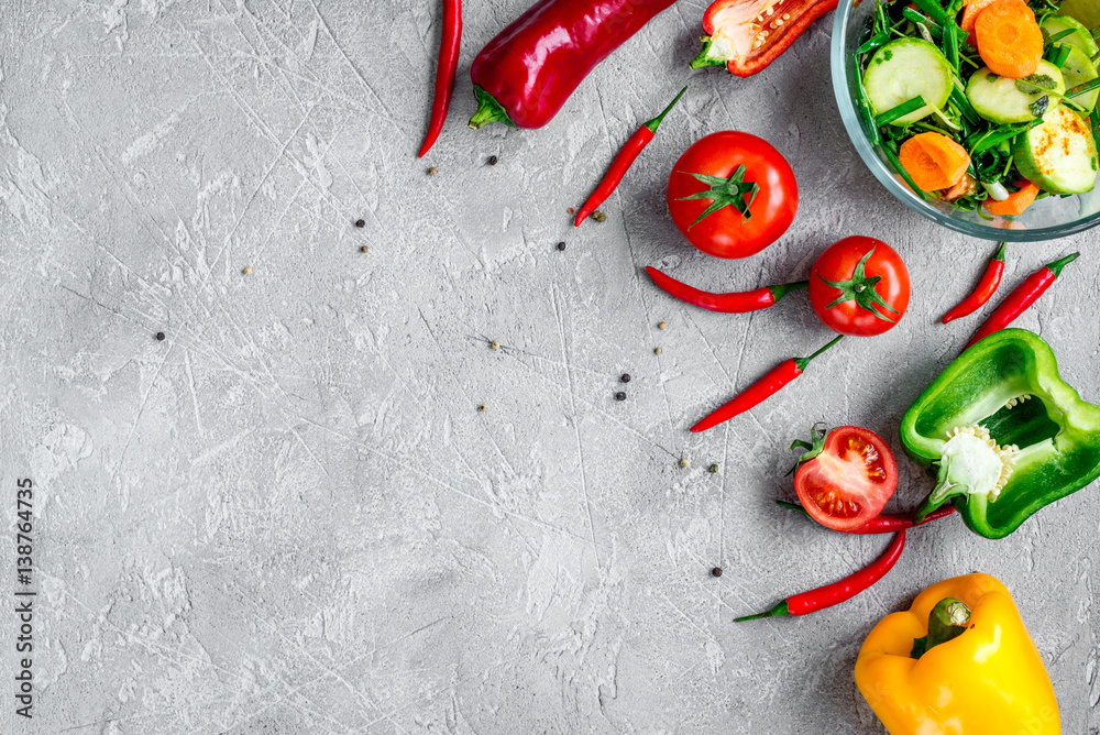 cooking vegetables on the stone background top view