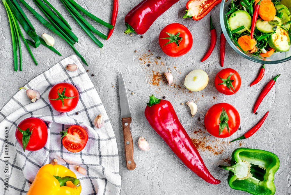 cooking vegetables on the stone background top view