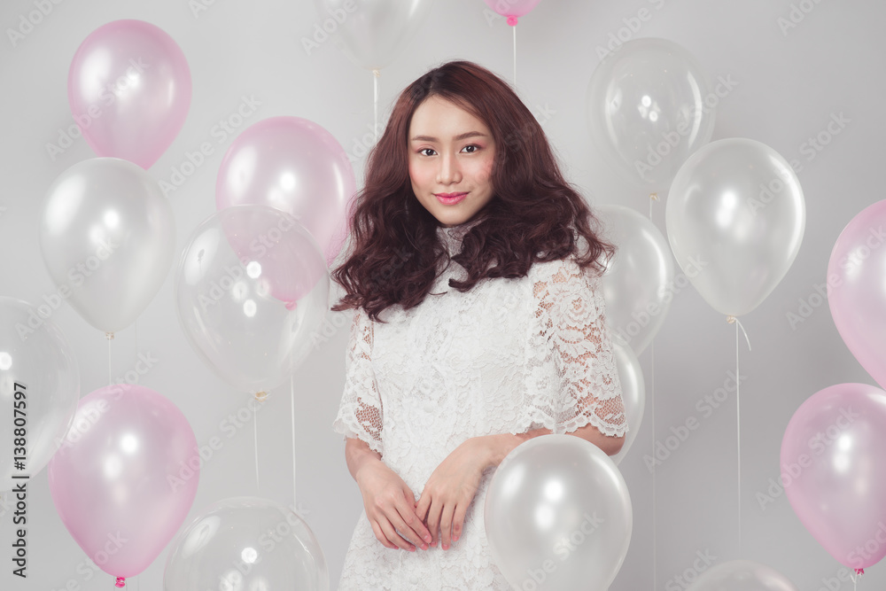 Stylish fashion asian woman with pastel balloons