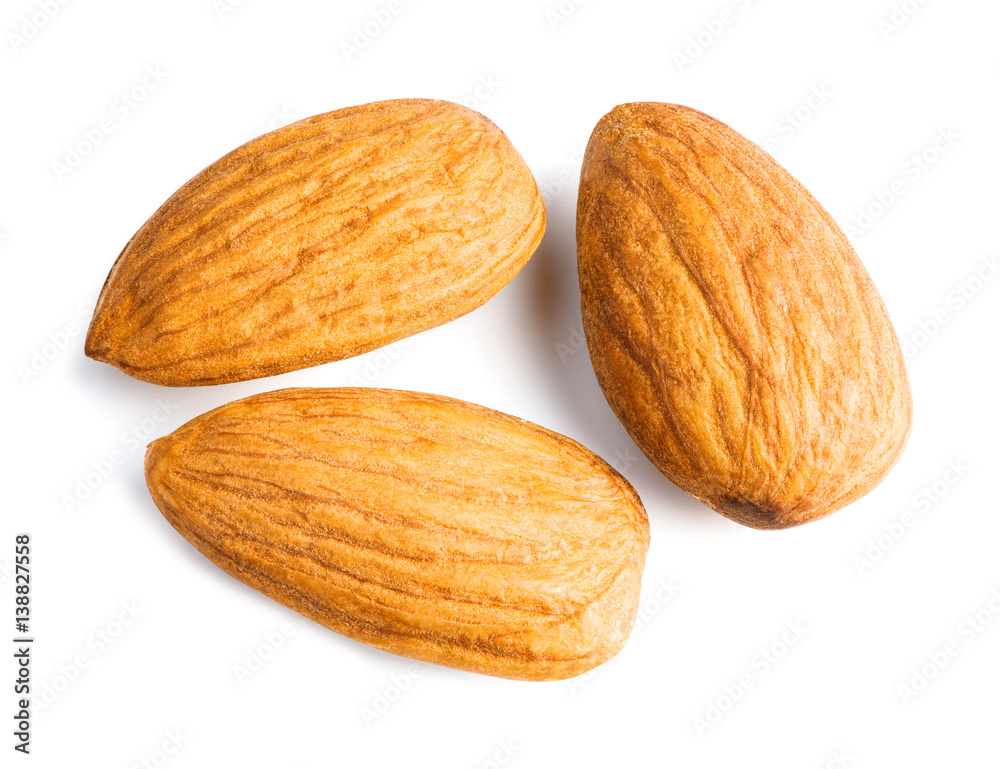 Three almonds nuts isolated on white background with clipping path. Top view.