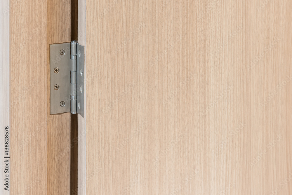 stainless door hinges on wooden swing door