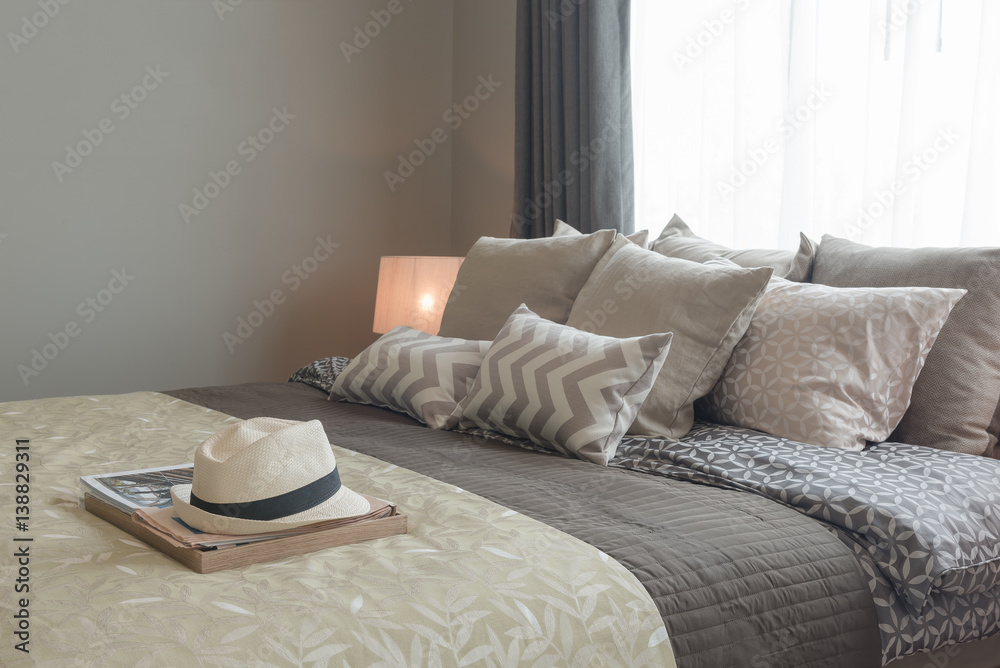 set of pillows on bed in cozy bedroom