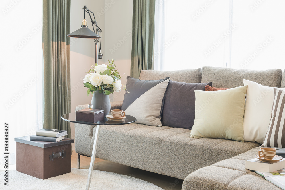 round glass table with set of sofa in modern living room