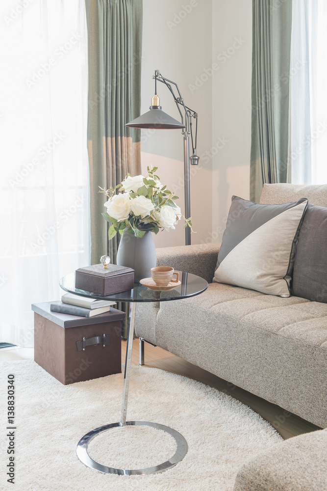 round glass table with set of sofa in modern living room