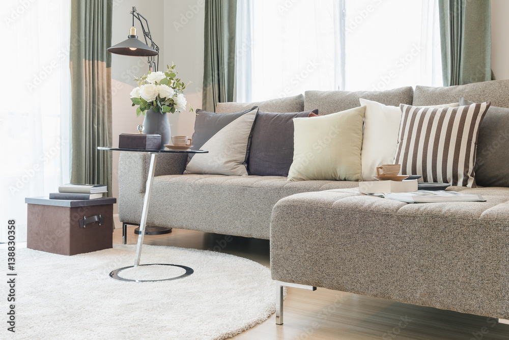 round glass table with set of sofa in modern living room