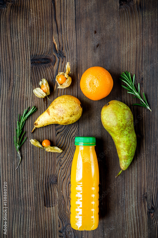 fitness smoothie in plastic bottle on wooden table top view mock-up