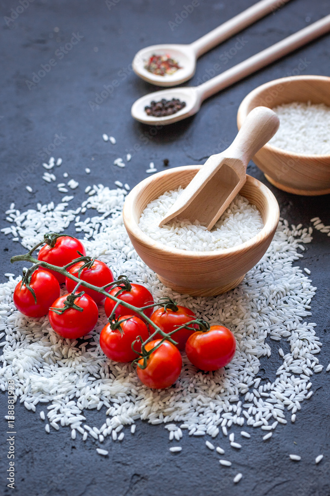 ingredients for paella on dark background