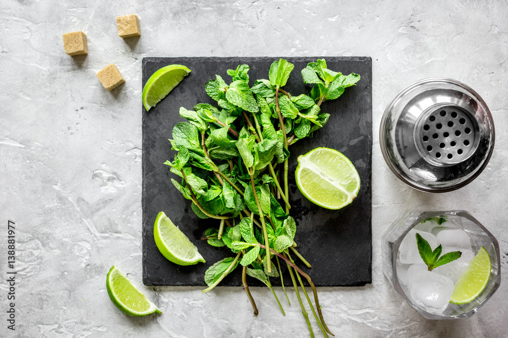 making mojito on stone background top view