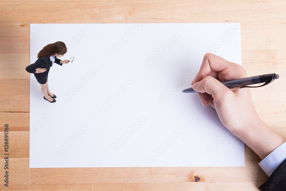 business woman uses magnifying