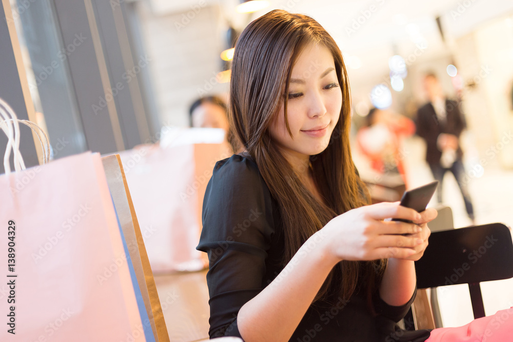 young asian woman shopping in modern shopping mall