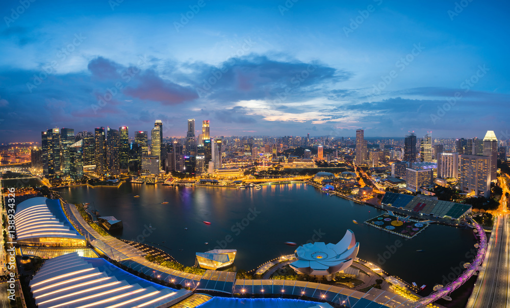 Aerial view of Singapore business district and city at night in Singapore, Asia.