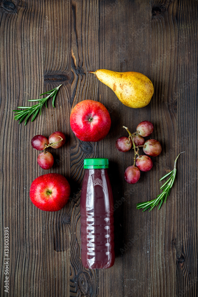 fitness smoothie in plastic bottle on wooden table top view mock up