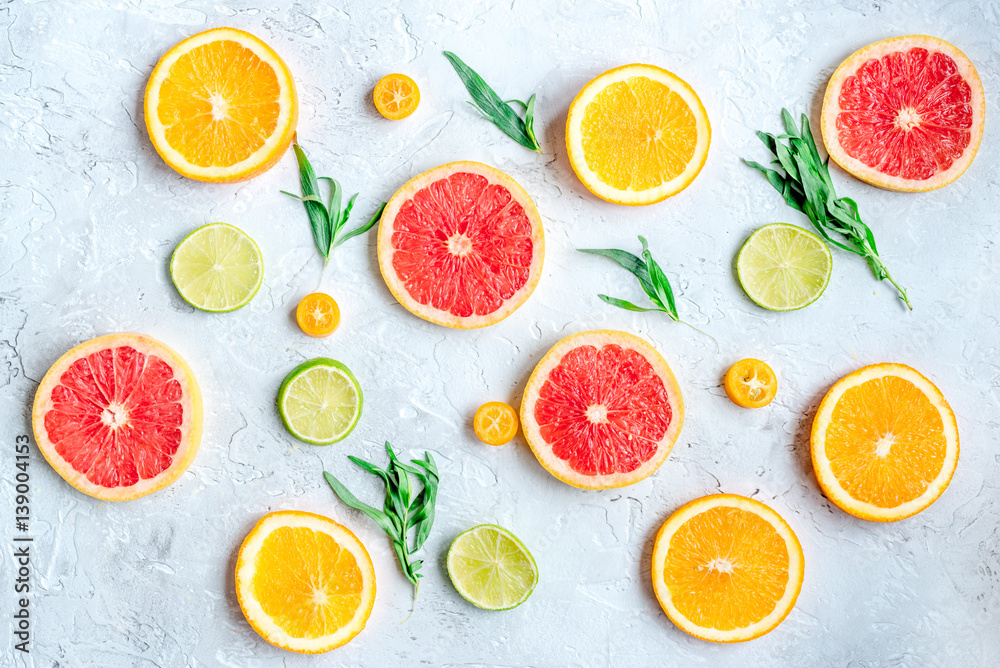 sliced citrus pattern on stone table background top view