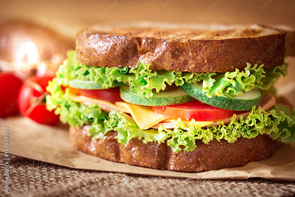 Grilled sandwiches bread with bacon , ham and cheese with vegetable , healthy breakfast