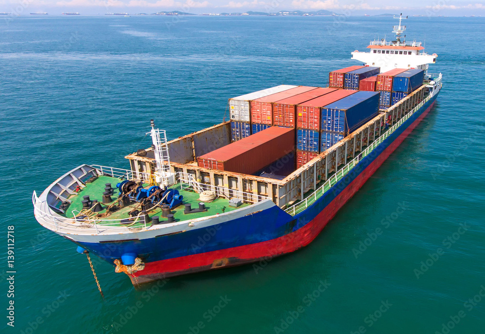 container ship in import export and business logistic.By crane ,Trade Port , Shipping,cargo to harbo