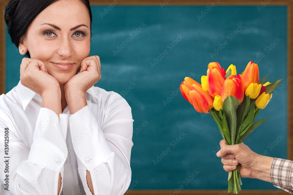 Hand holds flower.