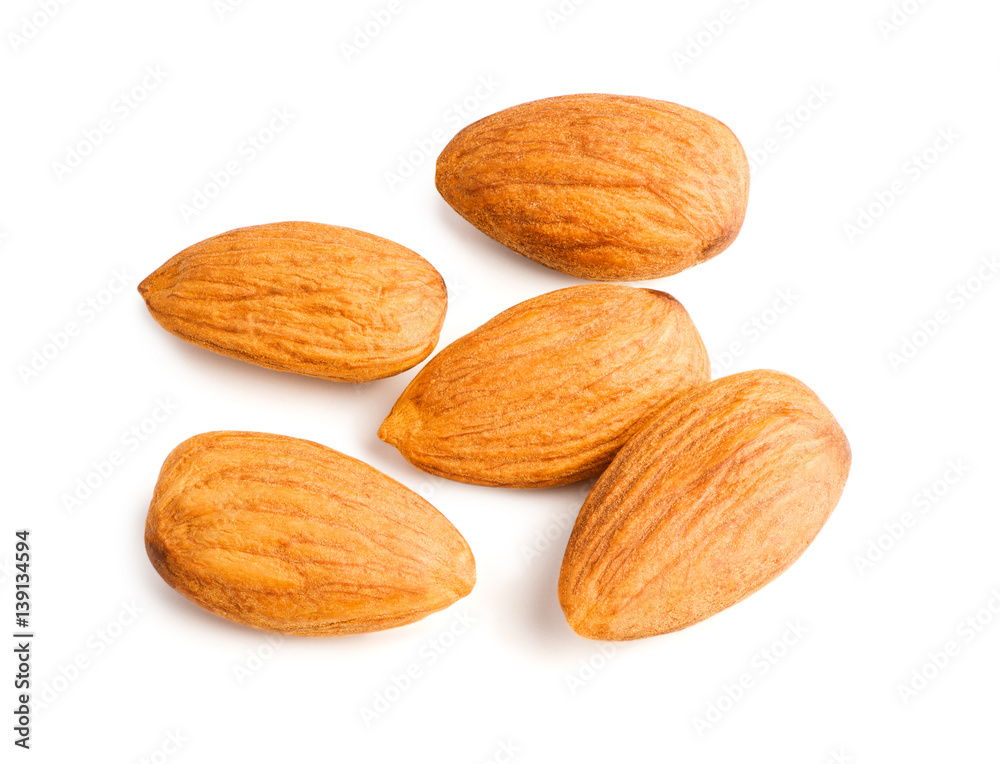 Five almonds nuts isolated on white background with clipping path. Top view. Macro.