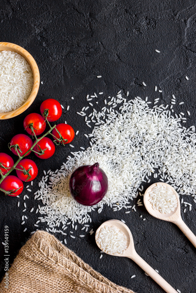 ingredients for paella on dark background top view