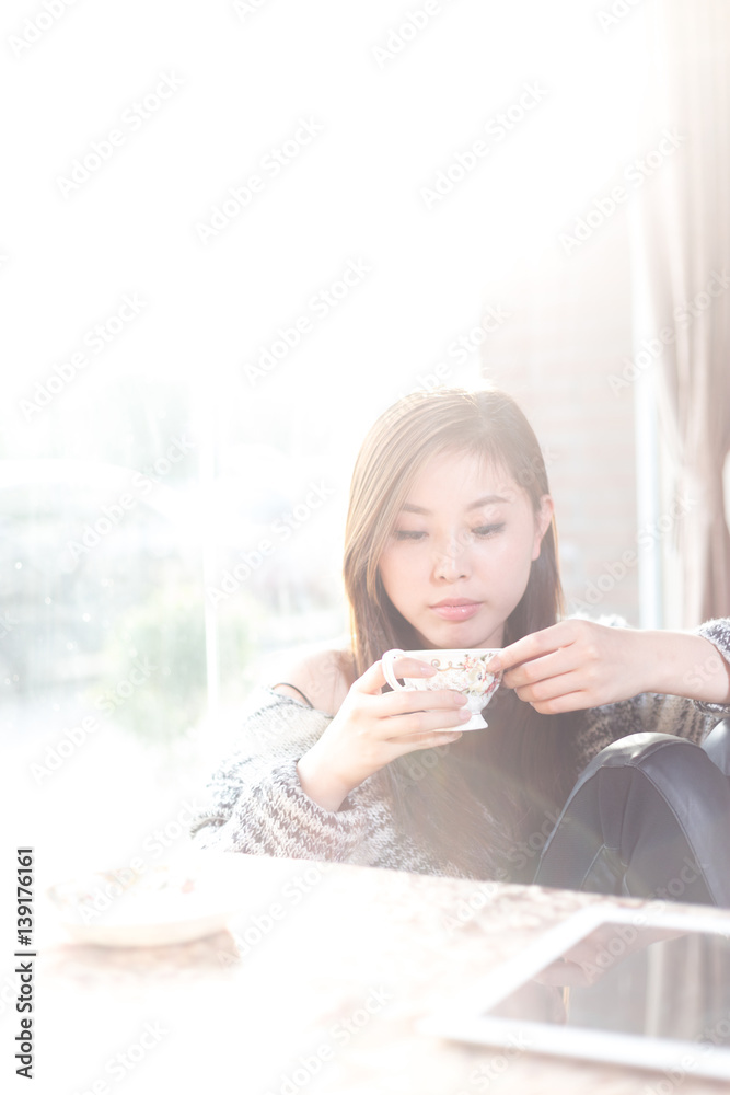 young pretty woman sits in cafe