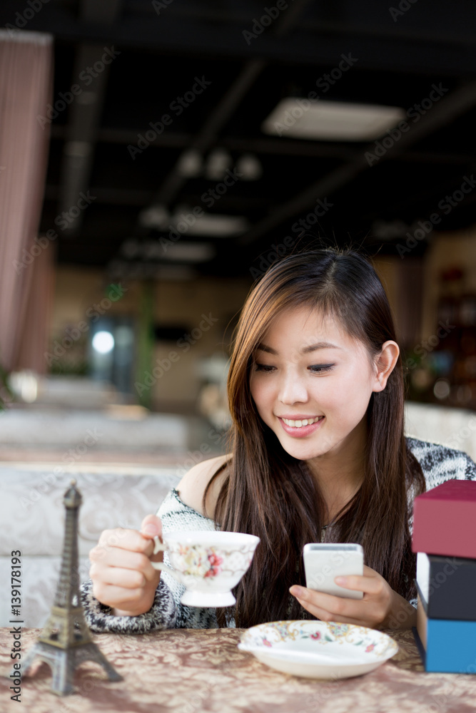 young pretty woman sits in cafe