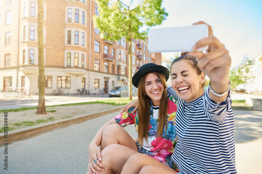 Candid image of a laughing woman taking a selfie