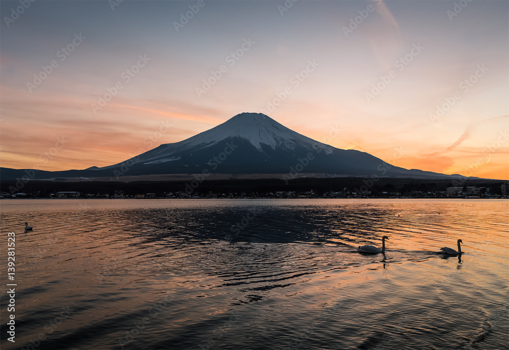 View of Mount Fuji and Lake Yamanakako in winter evening. Lake Yamanakako is the largest of the Fuji