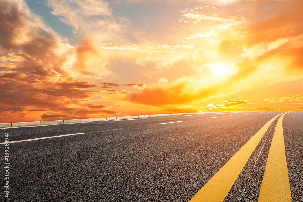 Asphalt road and sky at sunset