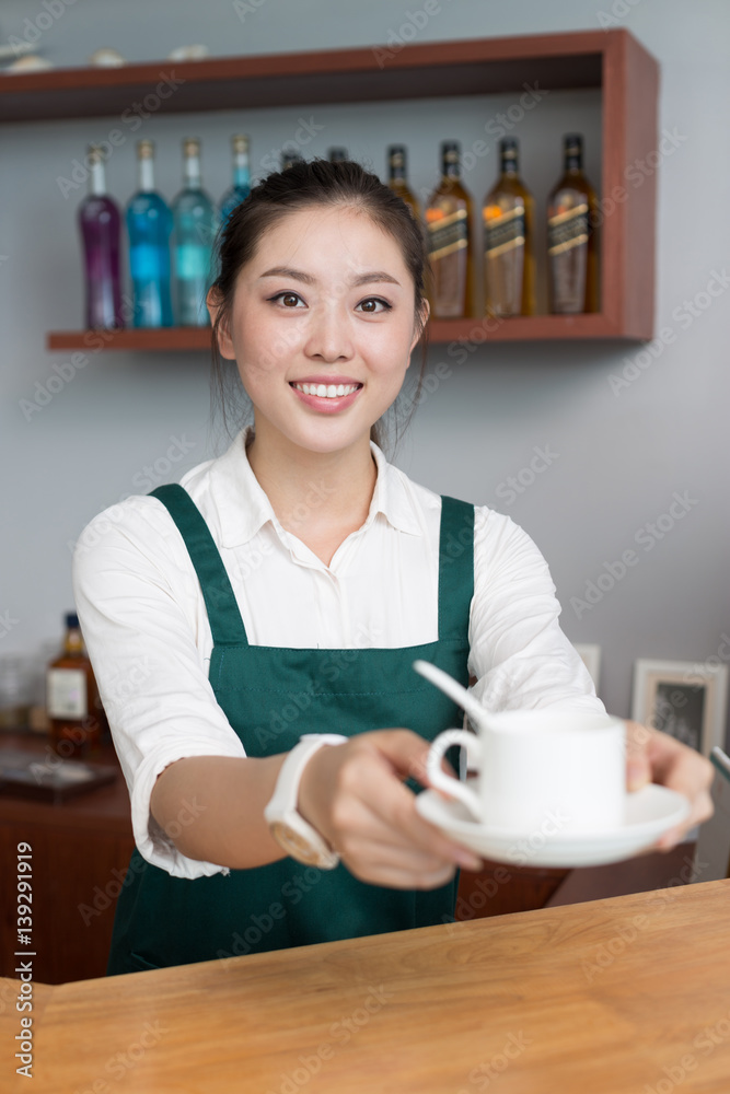 young pretty woman works in cafe