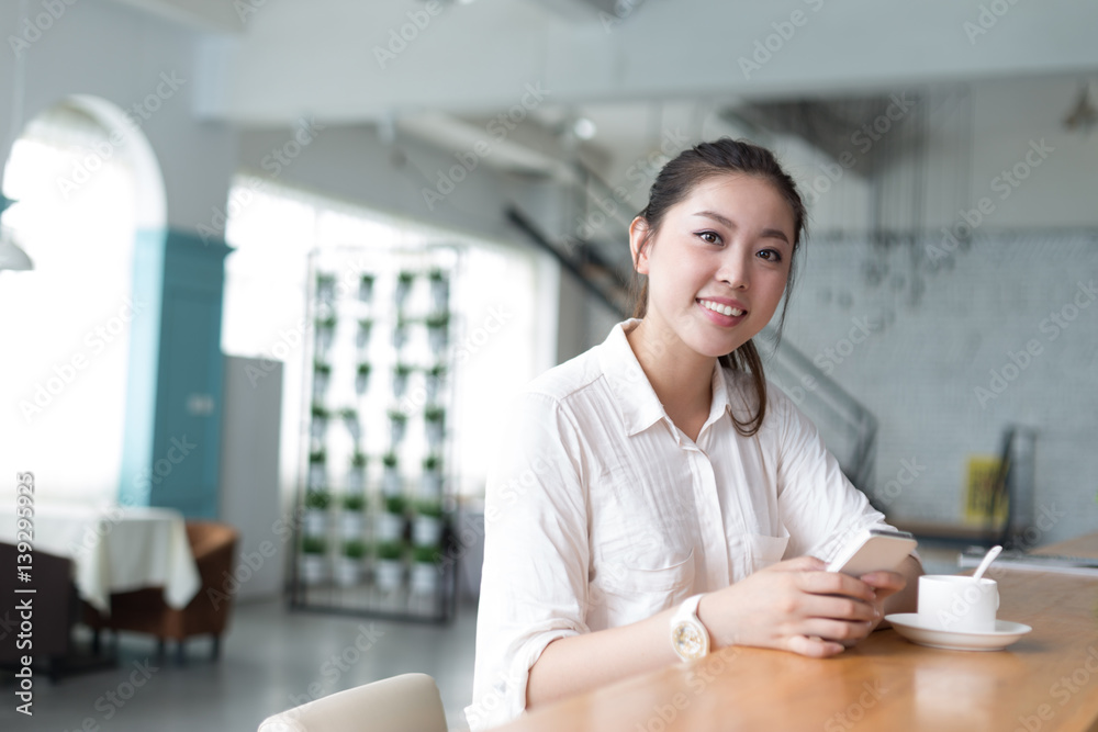 young pretty woman relaxes in office