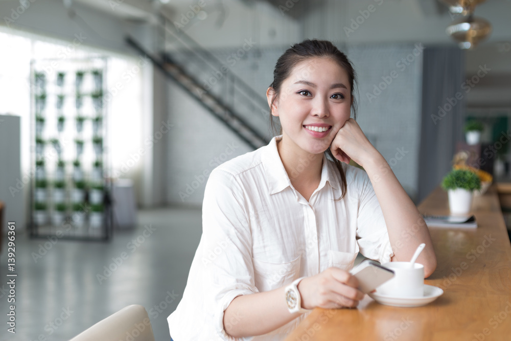 young pretty woman relaxes in office