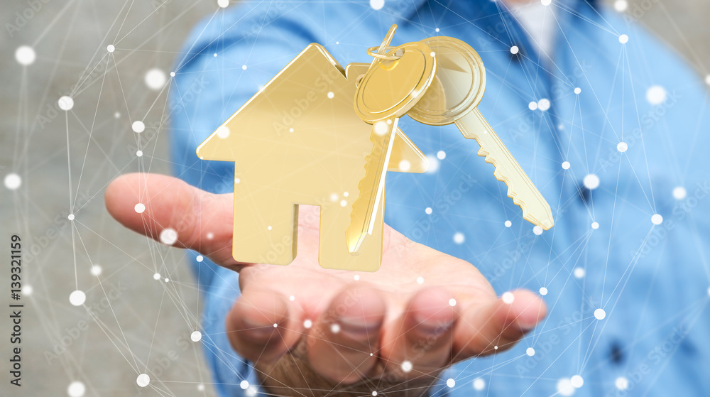 Businessman holding key with house keyring in his hand 3D rendering