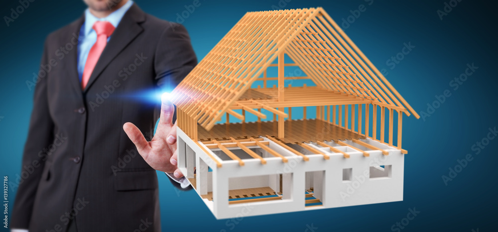 Businessman touching 3D rendering unfinished plan house with his finger