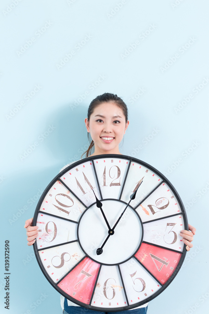 young pretty woman with clock