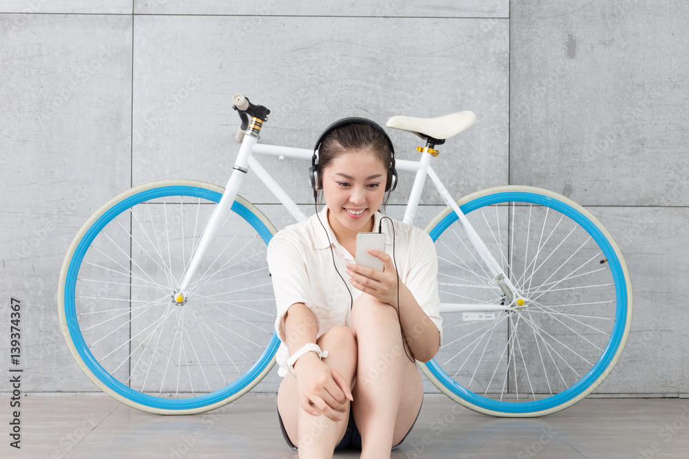 young pretty woman with bike