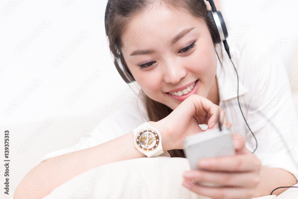 young pretty woman relaxes with mobile phone