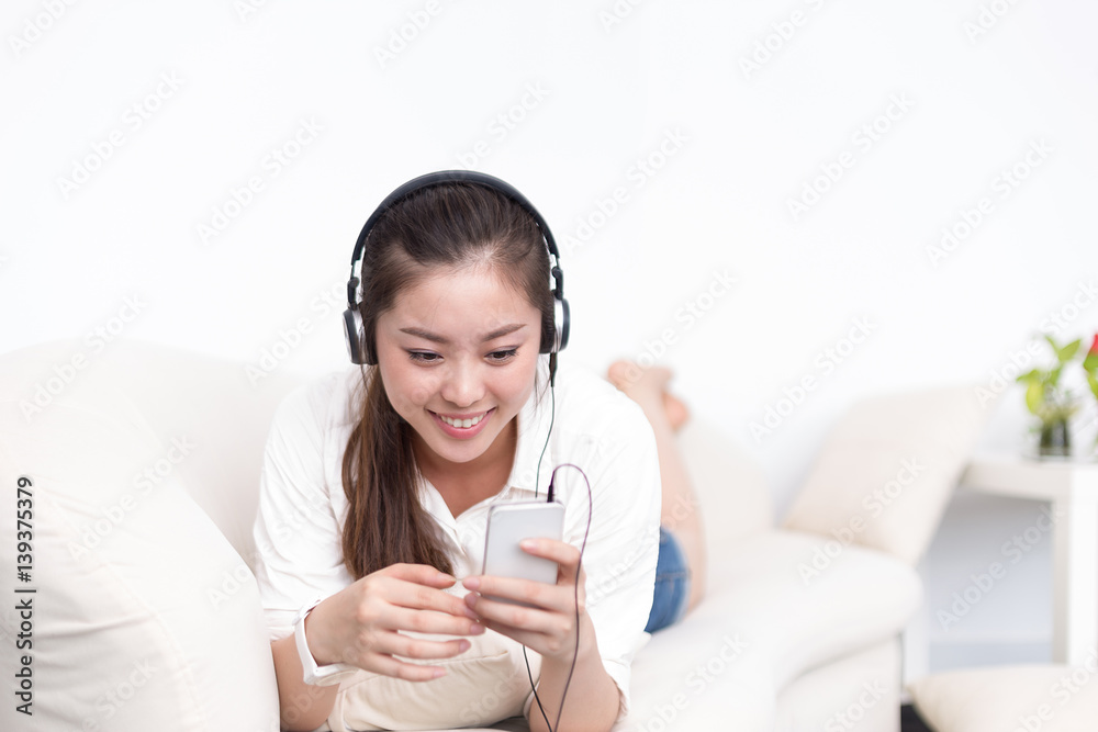 young pretty woman relaxes with mobile phone