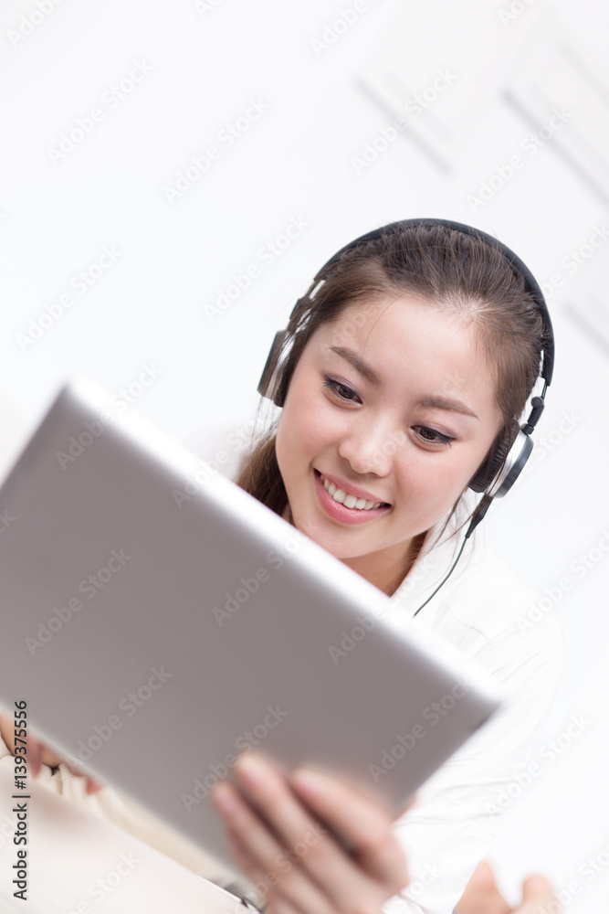 young pretty woman relaxes with tablet