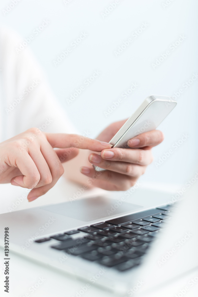 young pretty woman using laptop in office