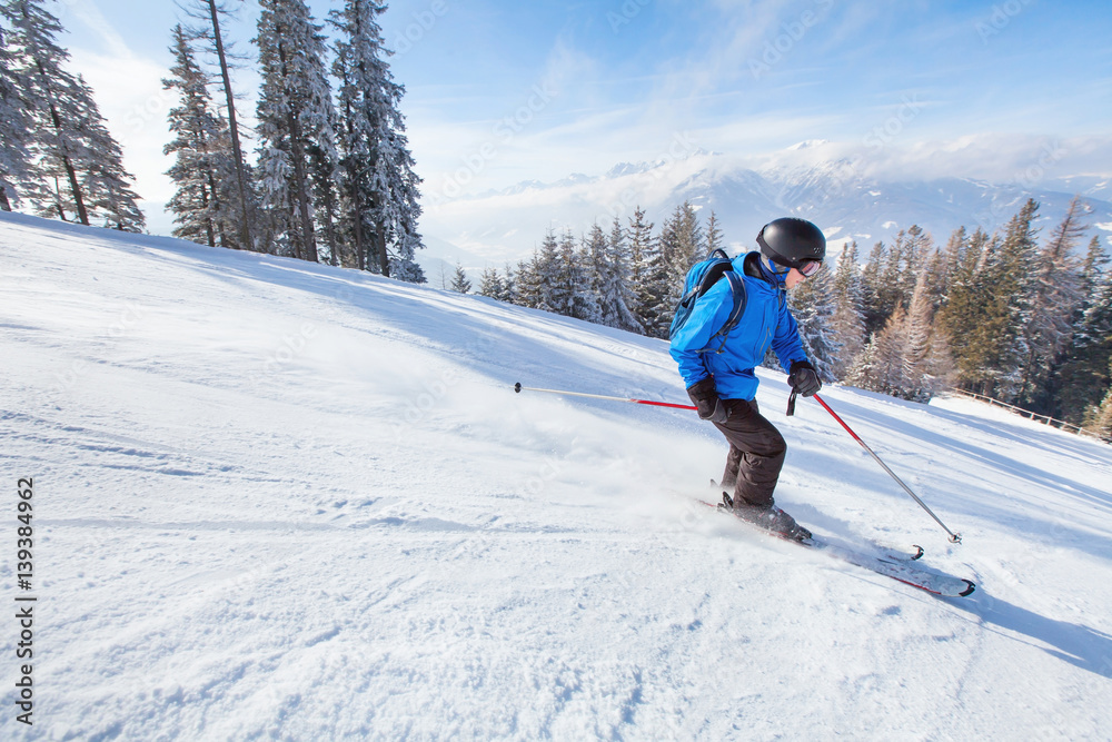 downhill skiing, skier going fast down the mountain, winter sport background