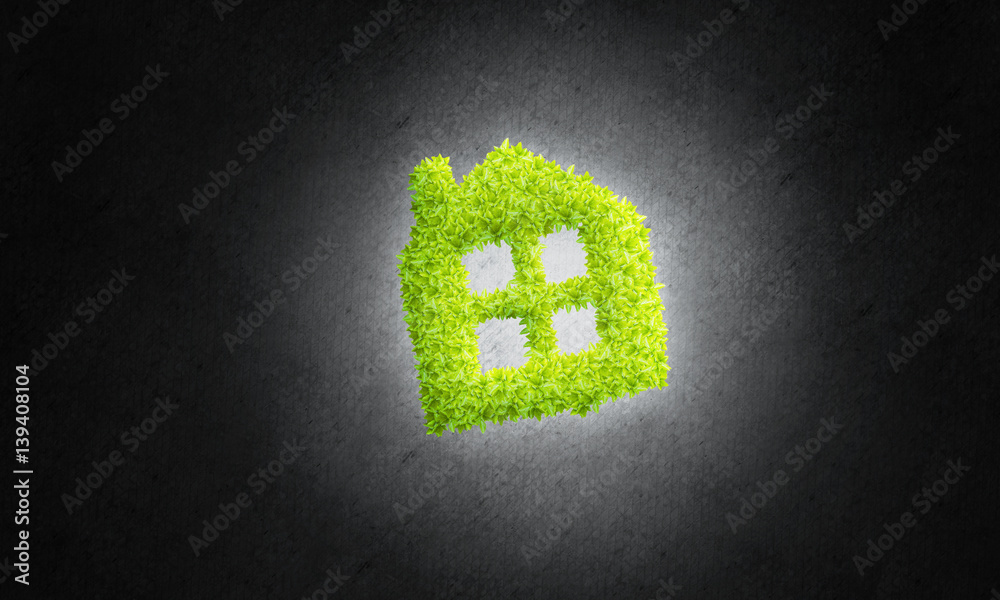 Concept of eco architecture presented by green house on dark background