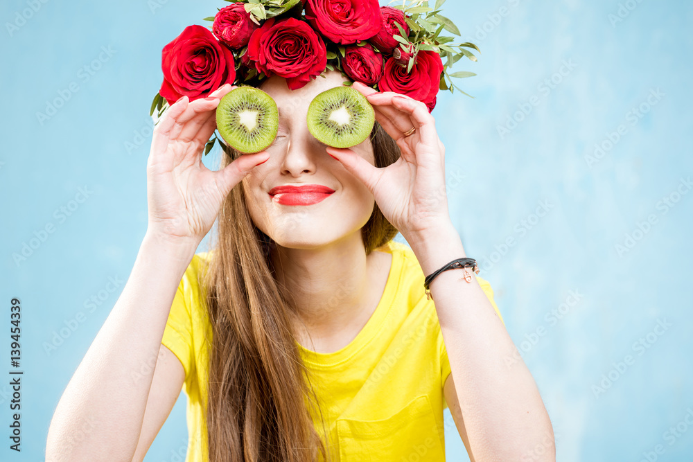 Colorful portrait of a beautiful woman grapefruit slices on the yellow background