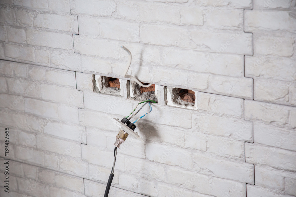 house work electricity  outlet wiring in the wall construction concept