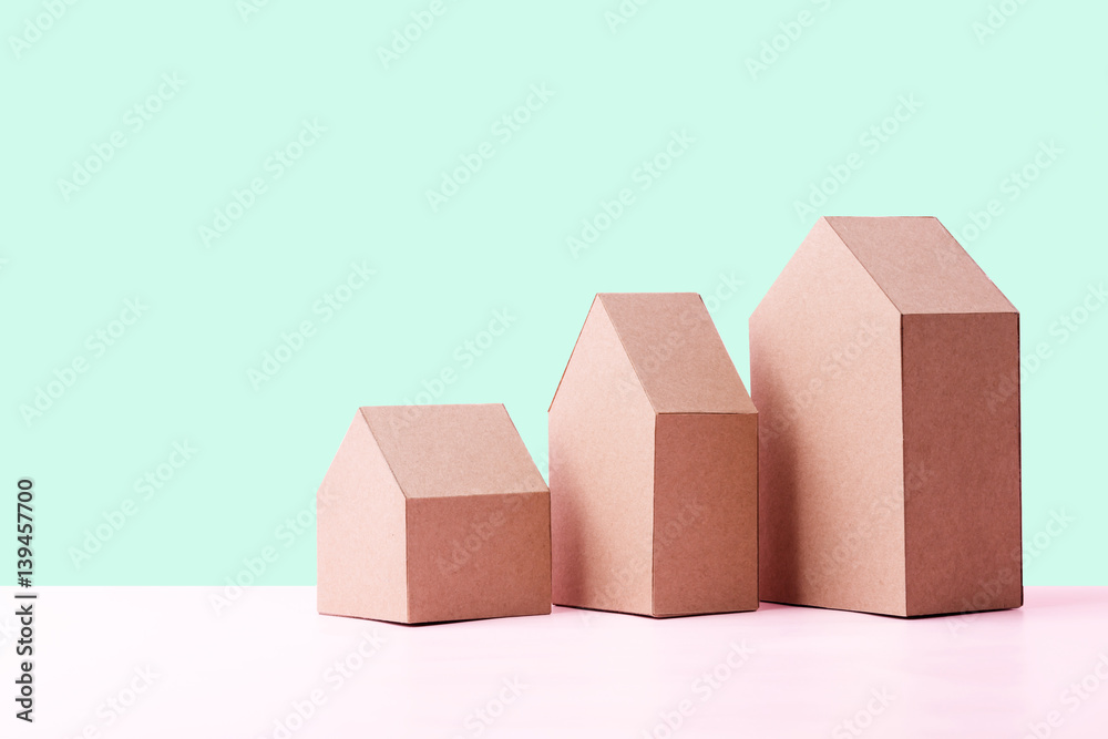 three house model cardboard with free copyspace house loan business concept